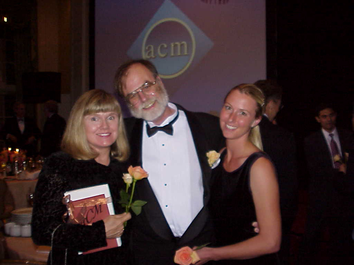 Jim Gray's wife Donna Carnes and his daughter Heather help him celebrate his Turing Award